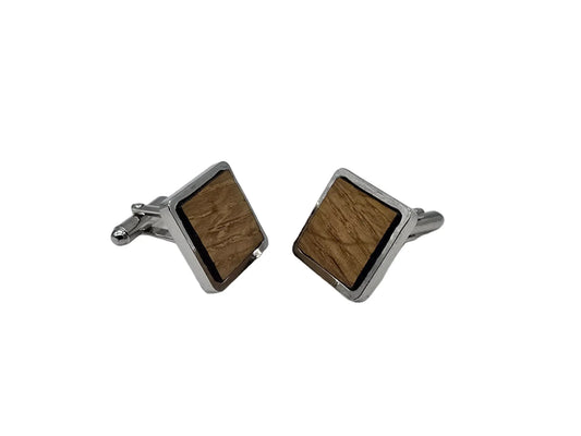 Square cufflinks with wooden texture on a white background